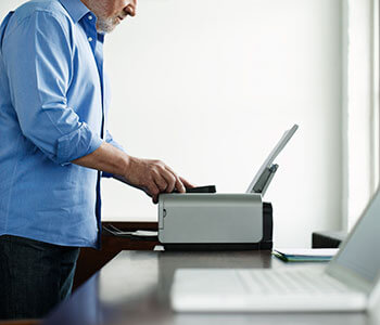 A man using a printer